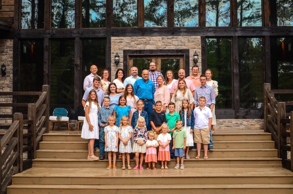 A large family posing for a picture on steps.