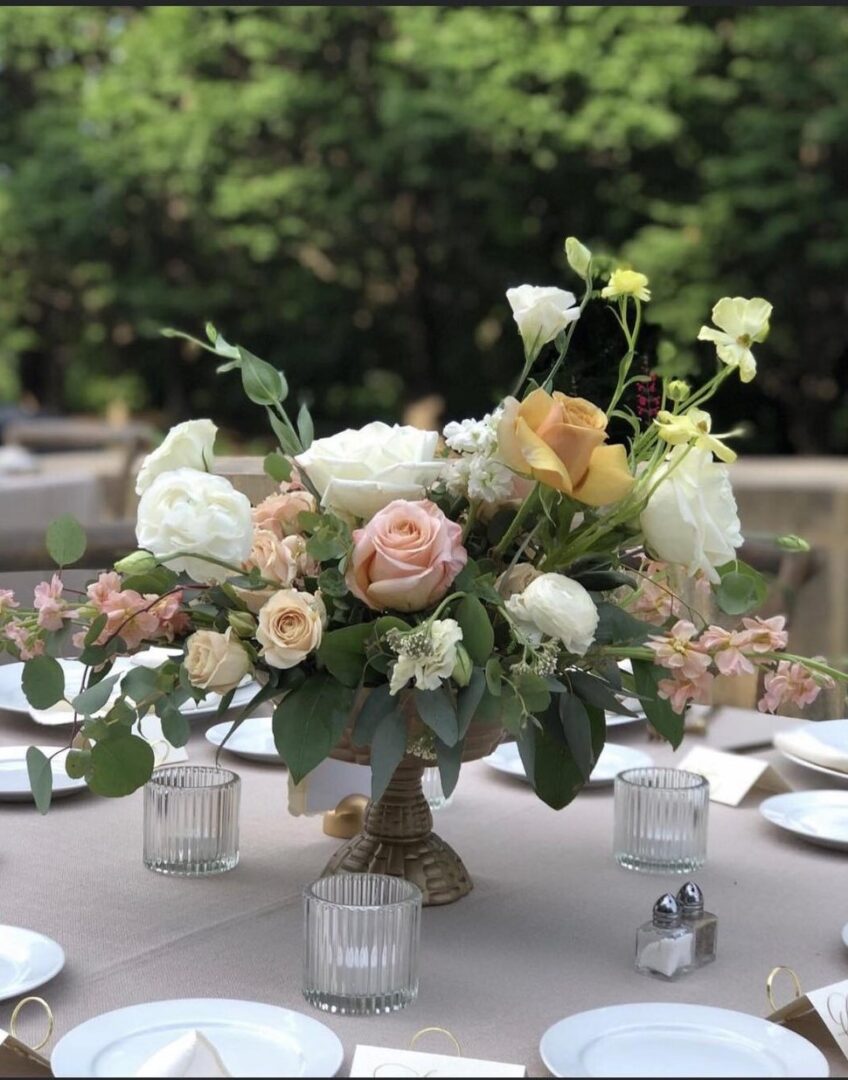 A table with flowers and candles on it