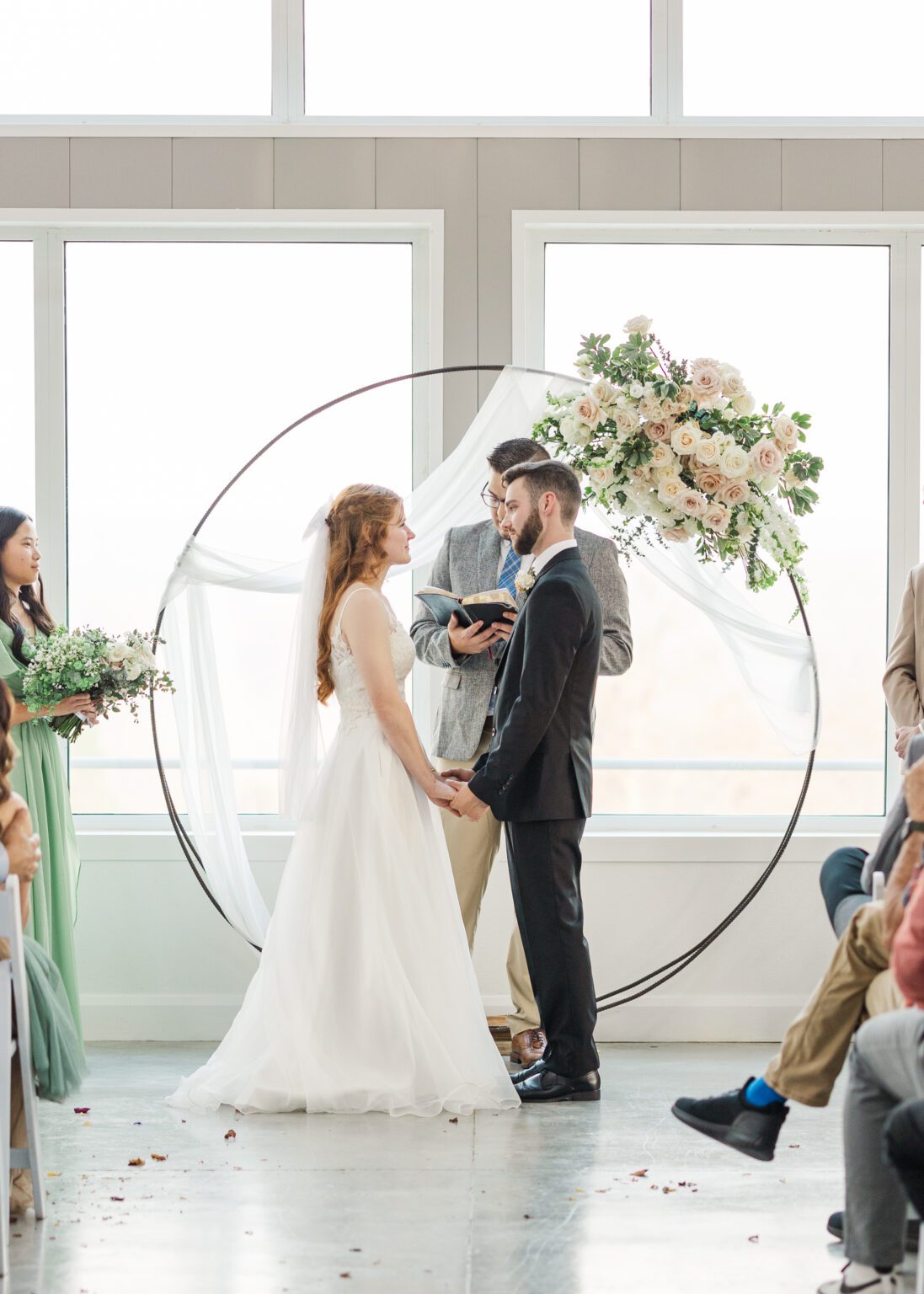 couple saying their vows to one another in marriage ceremony