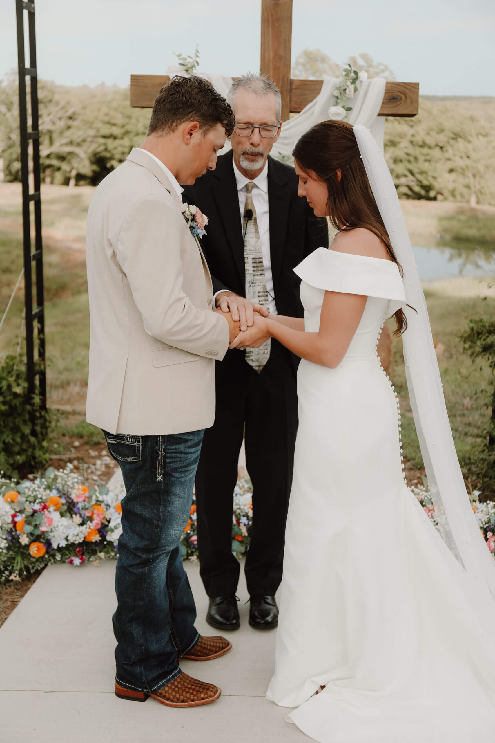 A man and woman holding hands while standing next to each other.