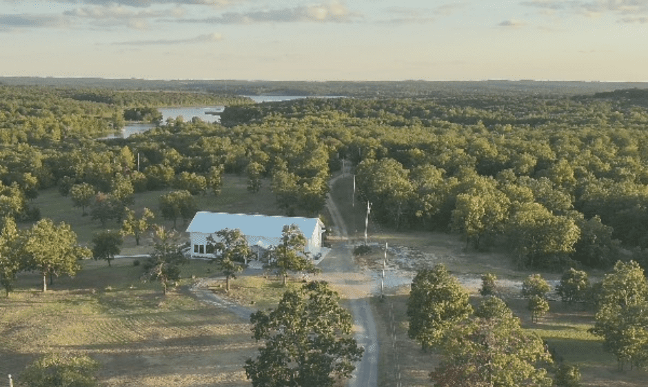 A large venue with trees and a road.