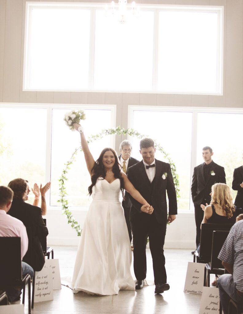 Happy bride cheers at Bella Rosa Venue in Sapulpa