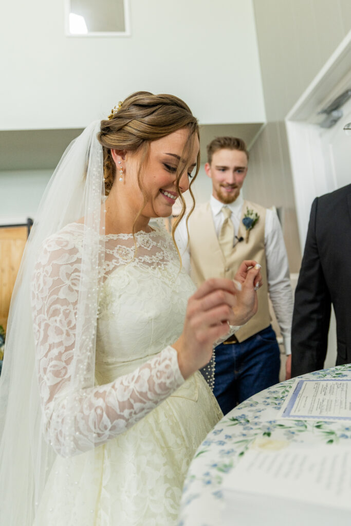 Bride and Groom signing marriage license at Bella Rosa Venue near Tulsa, OK